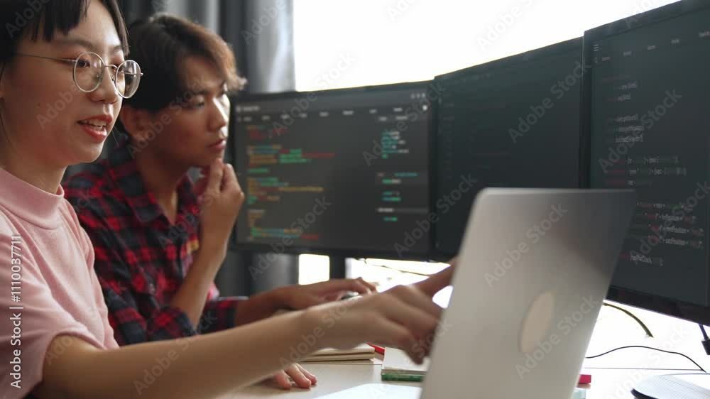 Wall mural slow motion back end software developer engineer for computer programming working together on debugg