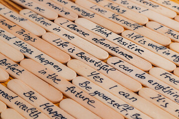 Positive thoughts for increasing selfesteem on wooden posts on wooden background