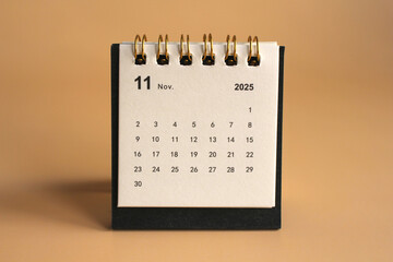 Monthly calendar template for the new year 2025 desk calendar,isolated on Beige background.