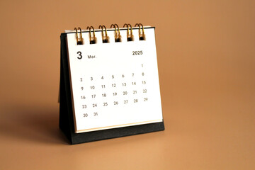 Monthly calendar template for the new year 2025 desk calendar,isolated on Beige background.