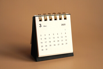 Monthly calendar template for the new year 2025 desk calendar,isolated on Beige background.