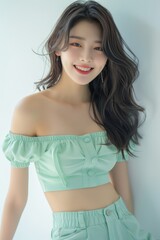 The pastel green attire emphasizes her glowing skin and gentle features, creating a calming and elegant vibe.