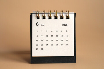 Monthly calendar template for the new year 2025 desk calendar,isolated on Beige background.