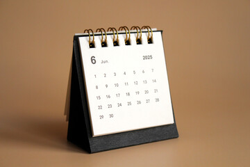 Monthly calendar template for the new year 2025 desk calendar,isolated on Beige background.