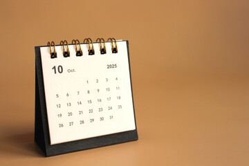 Monthly calendar template for the new year 2025 desk calendar,isolated on Beige background.