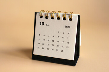 Monthly calendar template for the new year 2025 desk calendar,isolated on Beige background.