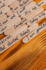 Positive thoughts for increasing selfesteem on wooden posts on wooden background