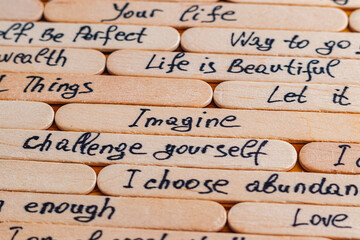 Positive thoughts for increasing selfesteem on wooden posts on wooden background