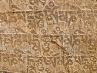 The image is of a wall with a lot of writing on it spiti valley, India