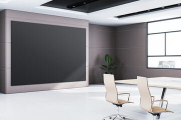 Modern conference room interior with large black display, table, and chairs, featuring window view and minimalist design. 3D Rendering