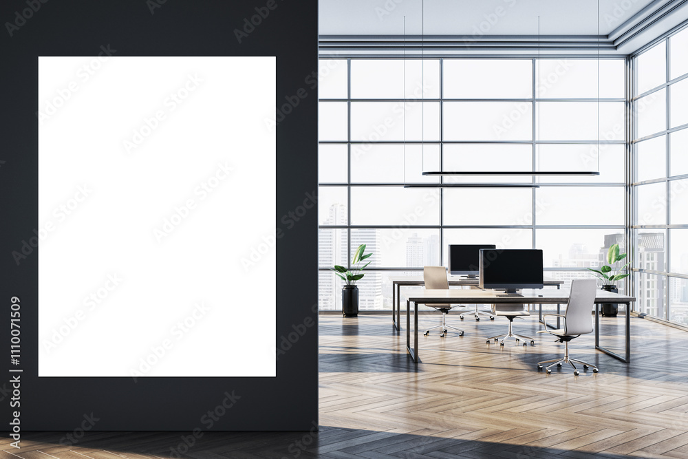 Poster modern office interior with a blank vertical poster on a black wall and workspace setup with desks a