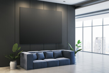 Modern waiting area with sofa, blank black poster, and potted plants in an office interior. 3D Rendering