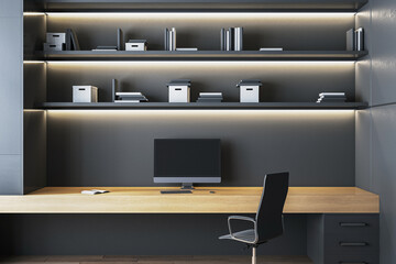 Modern minimalist workspace with wooden desk, black chair, computer monitor, and illuminated...