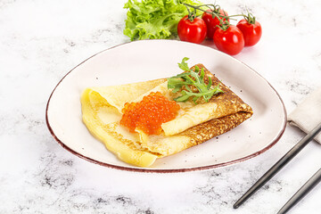 Russian pancake with red caviar