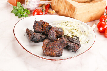 Grilled beef barbecue served onion