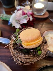 Gourmet macaron in a bird next plating