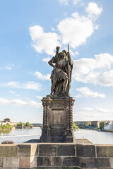 Sculpture of the St Christopher with baby Jesus on his shoulders by Emmanuel Max on Charles Bridge in Prague in Czech Republic