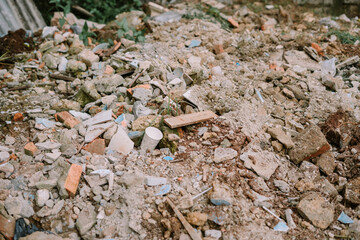 Debris from construction materials discarded in an open field,