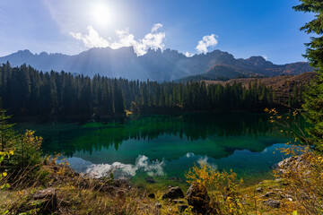 Stunning landscape and reflection of Karersee lake in autumn, Dolomite Italy.