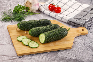 Raw green cucumbers with slices