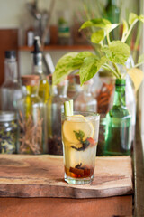 Fototapeta premium a Glass of Spices Herbal Drink Served on the Wooden Table
