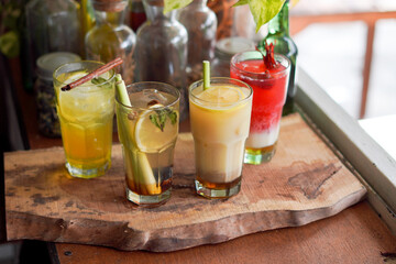 Fototapeta premium a Glass of Spices Herbal Drink Served on the Wooden Table