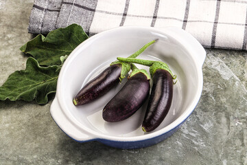 Small few baby eggplant over board