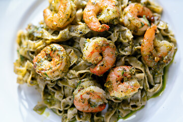 seafood pasta in pesto sauce