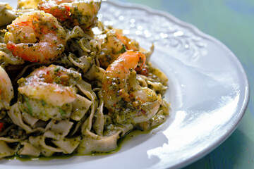 seafood pasta in pesto sauce