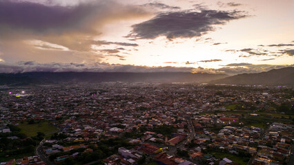 Aerial shot of a neighborhood in Cartago, Costa Rica during a beautiful sunset