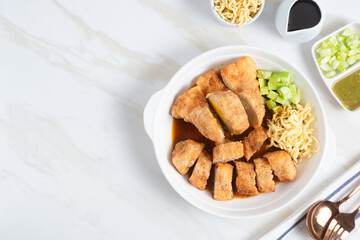 Pempek, traditional food from South Sumatra, Indonesia. This fish-based food is very popular. Served with cuko sauce and cucumber slices. Perfect for recipe, article, catalogue.