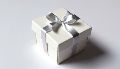"Minimalist white gift box with a beautiful satin ribbon bow, perfect for celebrations, gift ideas, and festive presentations in an elegant style."