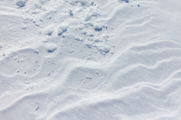 The snow is white and the ground is covered in it