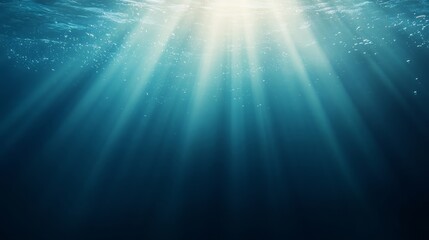 Obraz premium A beautiful blue ocean with sunlight shining through the water