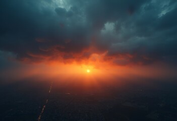 Fototapeta premium Dramatic cloudy sky with sunbeams breaking through the clouds at sunset