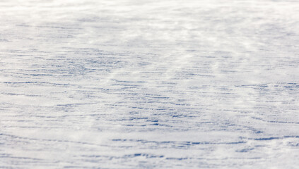 The snow is white and the ground is covered in it