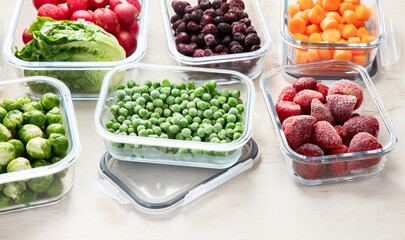 Boxes with fresh raw vegetables on table.