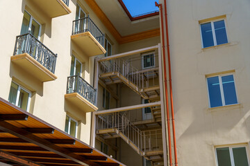 A building with a balcony and a fire escape