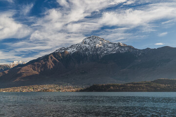 Lake view of epic sky against snow-capped mountain peak, Como, Italy
