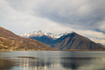 Cloud above the snow-capped mountain on lake Como, Italy