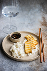 Rice, bbq slices of tofu cheese and soy sauce