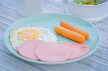 sunny side up egg with ham and sausage