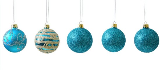 Turquoise Christmas decoration balls hanging elegantly on a white background showcasing festive sparkle and intricate designs.