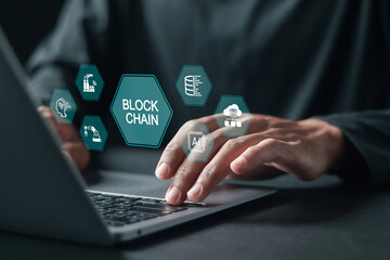 Blockchain industrial strategy concept, Person using laptop with blockchain icons for blockchain industry 4.0 technology on virtual screen.