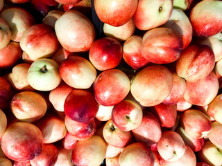 Bright juicy red peaches close-up in supermarket.