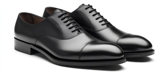 Classic black dress shoes elegantly arranged on a clean white background showcasing timeless style and sophistication for formal occasions.