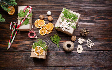 Christmas and zero waste, eco friendly packaging gift on wooden background. Eco christmas holiday concept. Sustainable christmas. Flat lay.