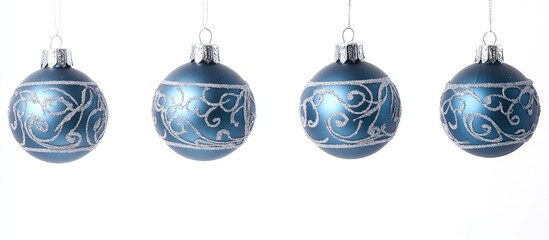 Elegant blue Christmas ornaments with silver embellishments hanging on a white background, perfect for festive holiday decor themes.