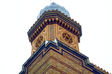 Architectural details of Cetate Synagogue in Timisoara (Timiș County, Banat): a close-up photo of the brick tower with its rich eclectic decoration. Judaism in Romania: a fragment of the Jewish Temple