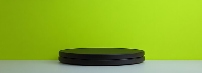 Glossy black podium on a smooth, light grey floor, placed against a vibrant lime green background with ample space for displaying a product.